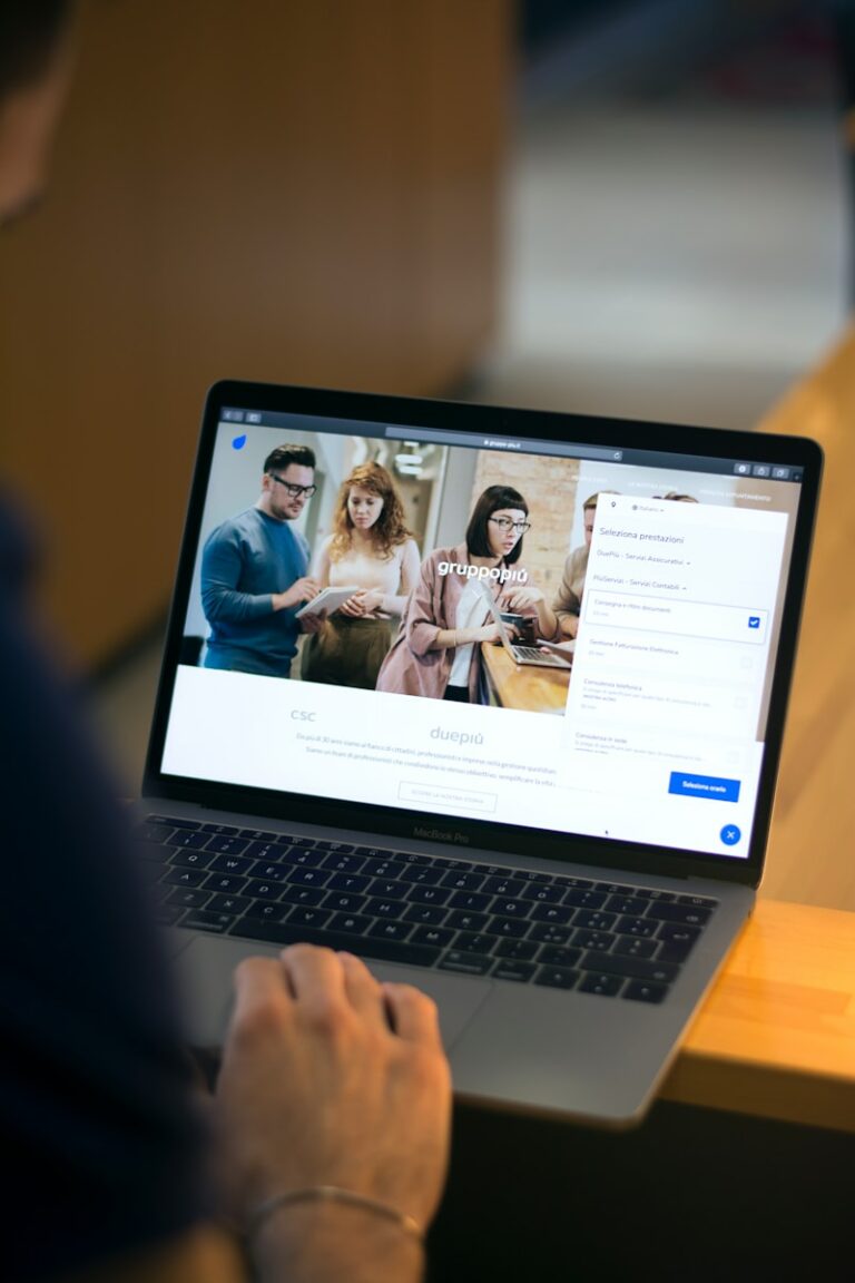 macbook pro on brown wooden table